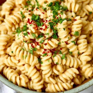 Creamy white bean pasta sauce served over al dente pasta in a cozy dish