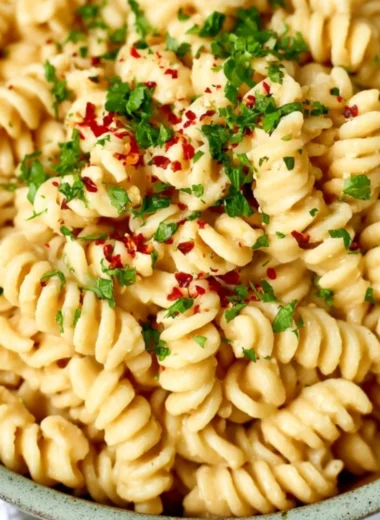 Creamy white bean pasta sauce served over al dente pasta in a cozy dish