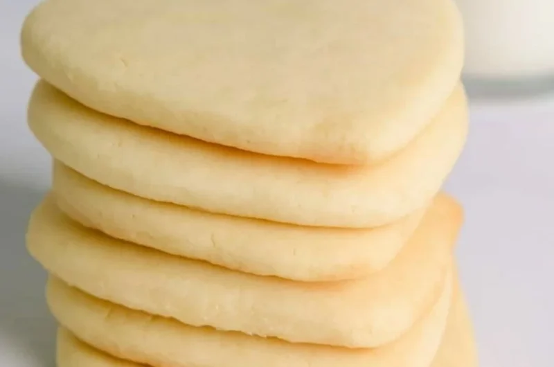 Cozy cut out sugar cookies decorated with colorful icing and sprinkles