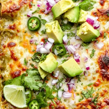 Cozy green chicken enchilada casserole baked in a dish