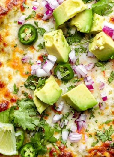 Cozy green chicken enchilada casserole baked in a dish