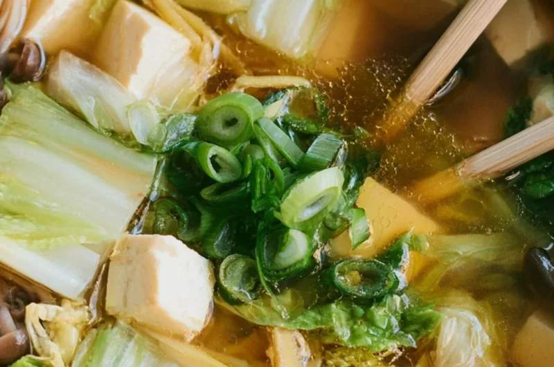 A bowl of delicious Napa Cabbage Tofu Soup filled with fresh greens and tofu.