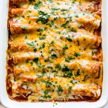 Delicious easy chicken enchiladas served on a plate with toppings