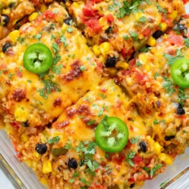 Healthy vegetarian rice and bean casserole served in a vibrant dish