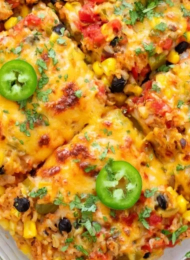 Healthy vegetarian rice and bean casserole served in a vibrant dish