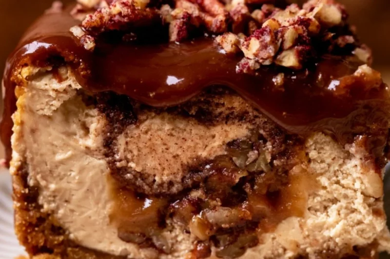 Delicious pecan pie cheesecake topped with whipped cream
