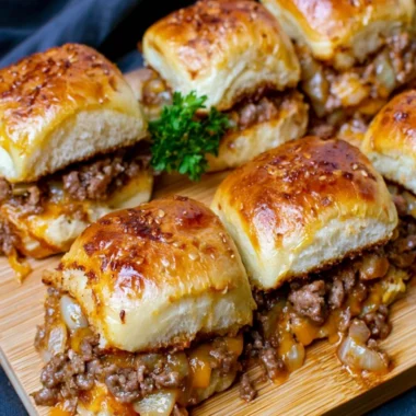 Cheeseburger sliders with Hawaiian rolls on a serving platter
